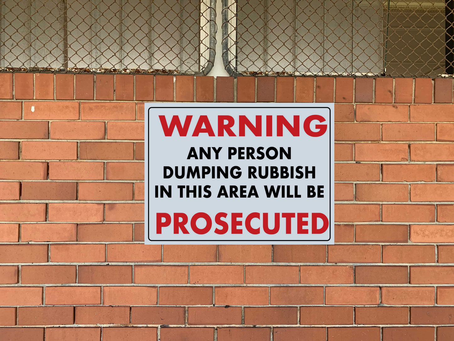 Warning Any Person Dumping Rubbish In This Area Will Be Prosecuted Sign