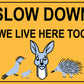 Slow Down We Live Here Too Sign