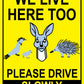 We Live Here Too Please Drive Slowly Bright Yellow Sign